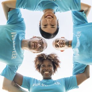 Group of happy and diverse volunteers